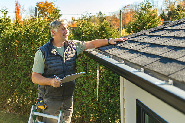 Professional Storm Damage Roof Repair technician working in Ashford, CT